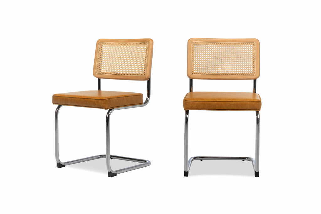 Set of two Nora dining chairs with the seat cushion upholstered in vegan leather placed side by side 